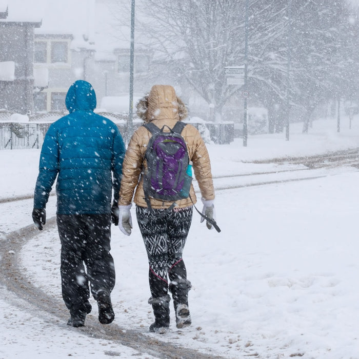 Snowy UK town, couple need ice grips from ICEGRIPPER