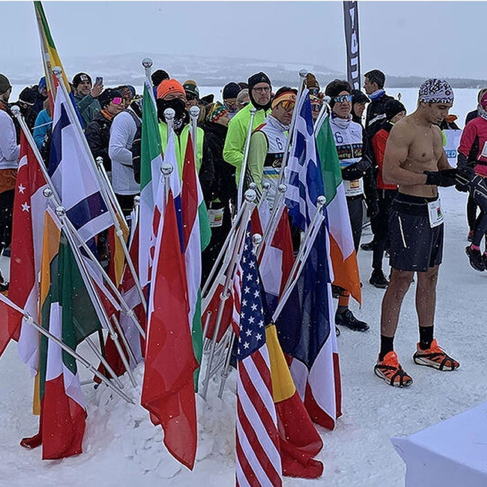 Runners competing in the Icebug Frozen Lake Marathon on frozen Tisleifjorden, Norway
