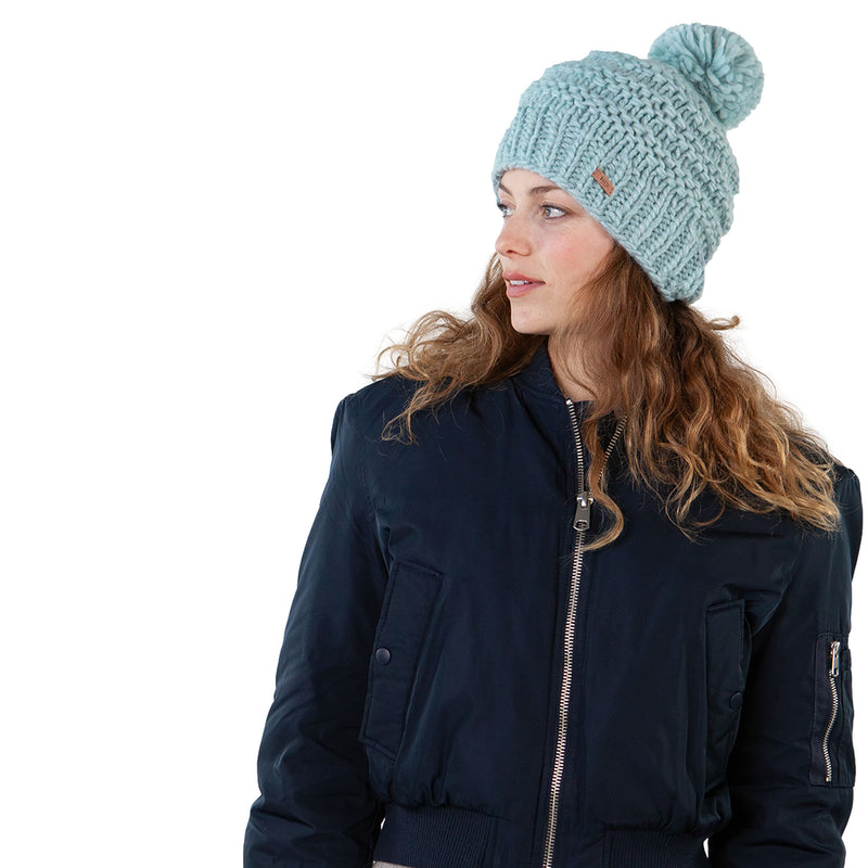 Barts Jasmin, Ice, is a classic hand knitted beanie showcases a beautiful rib pattern, topped with a playful pom. Designed with a higher fit, it offers a chic and modern look. The fleece lined headband provides a comfortable fit. Strolling city streets? Sipping coffee by the piste? Gearing up for an adventure? The Jasmin Beanie is your perfect cold-weather companion. Buy now at ICEGRIPPER.