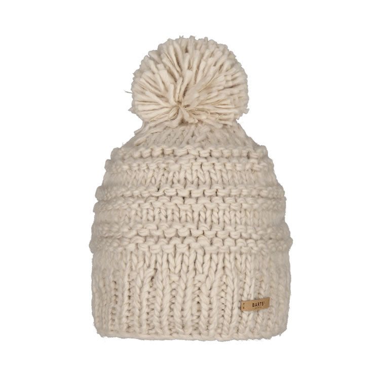 Barts Jasmin, Beige, is a classic hand knitted beanie showcases a beautiful rib pattern, topped with a playful pom. Designed with a higher fit, it offers a chic and modern look. The fleece lined headband provides a comfortable fit. Strolling city streets? Sipping coffee by the piste? Gearing up for an adventure? The Jasmin Beanie is your perfect cold-weather companion. Buy now at ICEGRIPPER.