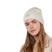 Female model looking staright on wearing the Barts Darty Beanie in Cream. Demonstrating how the higher fit of this soft, ribbed knit beanie looks.