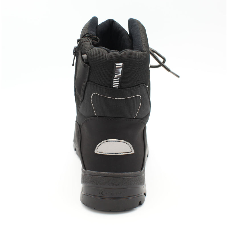 The Keele Men's winter boot, black, designed to tackle everything the season throws at you. Cold, wet, or icy conditions are no match for its rugged build, with a 100% waterproof matt PU and nylon upper and the patented OC anti slip system built into the sole. Buy now at ICEGRIPPER.