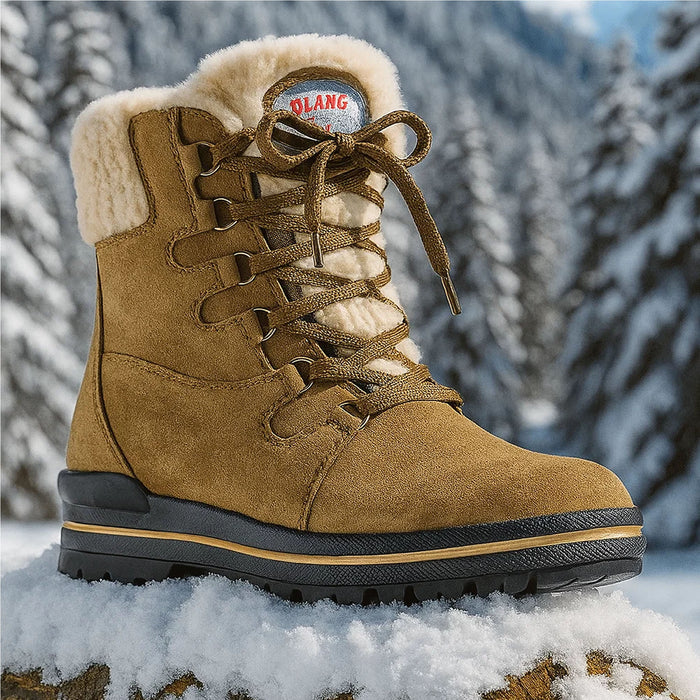 Olang Meribel BTX OC Women Winter Thermal Snow Boots with OC Ice Grip System, Tan. Shown in a snowy, mountainous environment - typical of where it might be worn. Buy now at ICEGRIPPER.