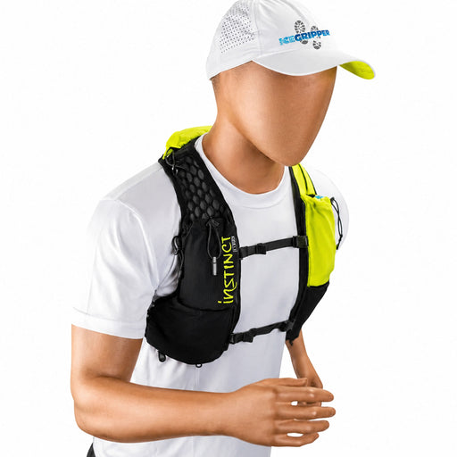 A man wearing a neon yellow running hydration vest by Instinct, shown from the chest up against a white background. Instinct PX 3.1L Trail Vest including 2 x 600ml soft flasks. Buy at ICEGRIPPER now.