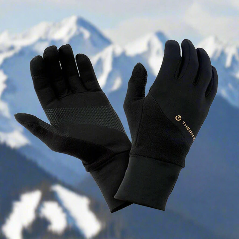 Active Light Tech Glove in Black. Showing gloves against a snowy mountainscape to demonstrate the Lightweight, Tactile, Multi-Activity Glove, suitable for All-Season Comfort. Buy now at ICEGRIPPER.