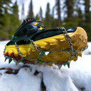 ICEGRIPPER ACTIVspikes in the snow, shown here on a trail shoe. Buy now at ICEGRIPPER.
