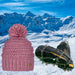 Pink Jasmin Barts Beanie, paired with ICEGRIPPER ACTIVspikes, as a special 'bundle' offer for the 2026 Milano-Cortina Winter Olympics. Both products superimposed over a snowy ski slope background.