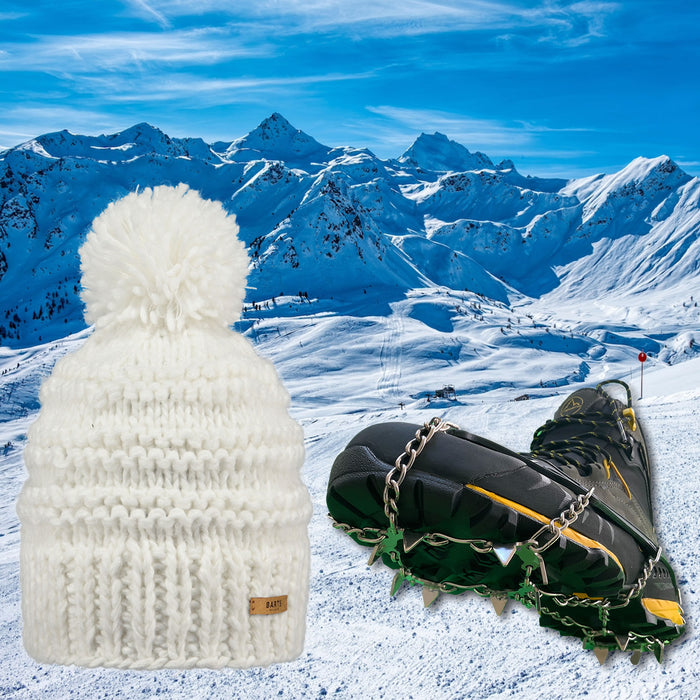White Jasmin Barts Beanie, paired with ICEGRIPPER ACTIVspikes, as a special 'bundle' offer for the 2026 Milano-Cortina Winter Olympics. Both products superimposed over a snowy ski slope background.