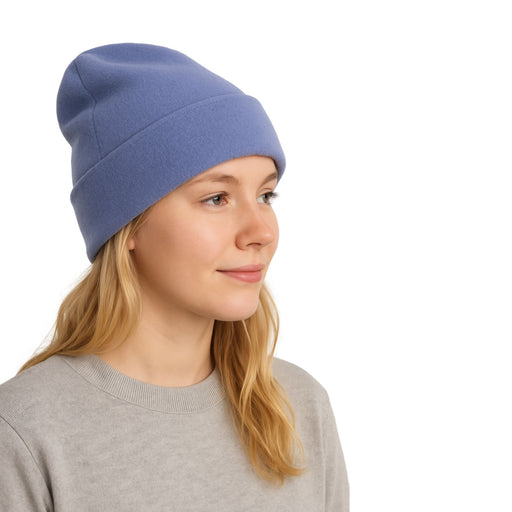 Person wearing the ICEGRIPPER Long Beanie in Bluebell. Demonstarting how it can be worn mid length with a turn-up.