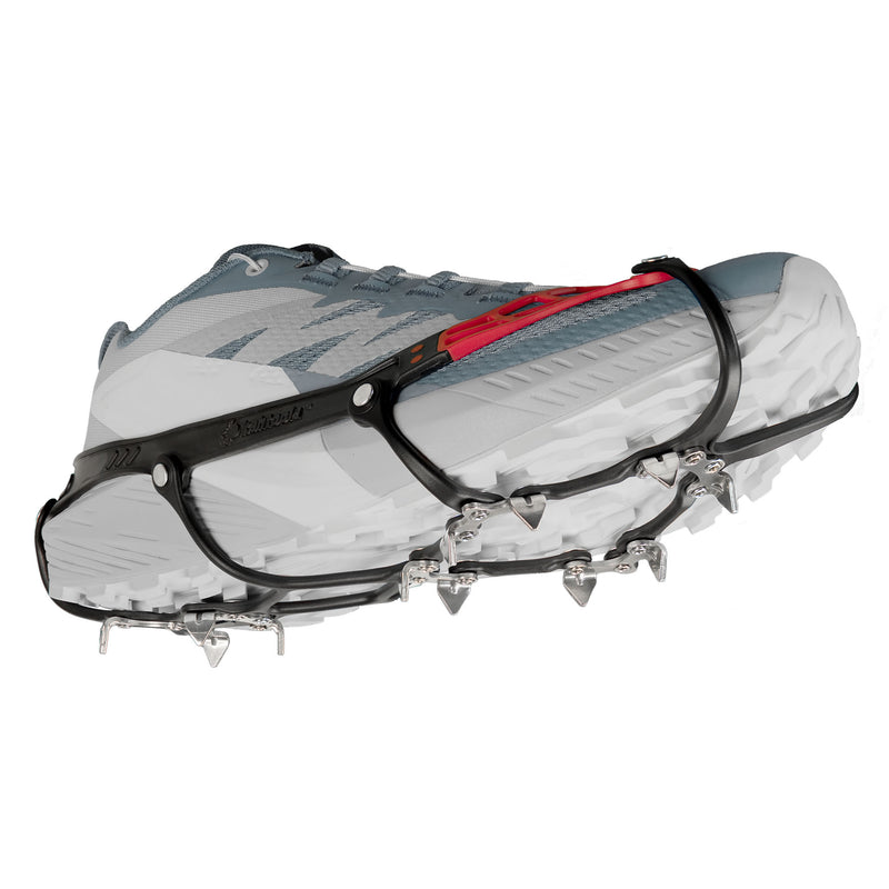 Side view of the new Kahtoola Microspikes Ghost Footwear Traction on a trail shoe. The TPU and TPE construction can be seen. This unique mixture and design is partly responsible for the featherlight weight. Patented Reinforced Eyelets – TPR inserts embedded at harness connection points strengthen key stress areas for long-term reliability. 