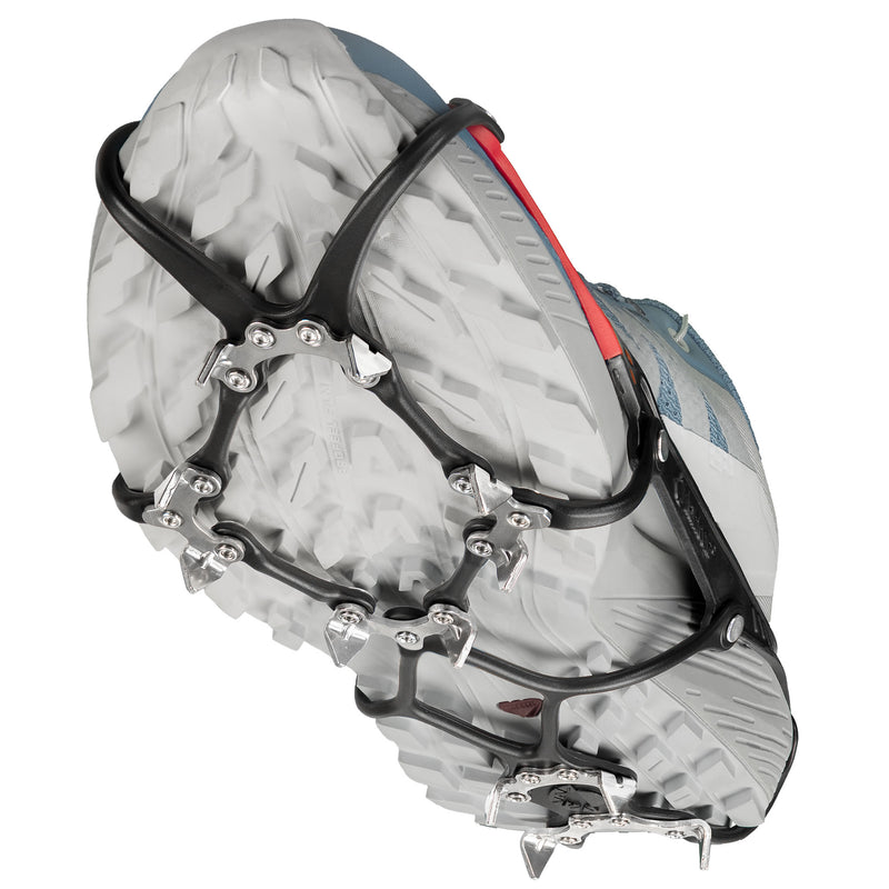 Kahtoola Microspikes Ghost Footwear Traction in an elevated walking positon, showing the underfoot TPU matrix and 12, 9mm stanless steel spikes and articulated design, which helps the Ghost to shed snow and debris, helping to give solid traction on snow and ice.