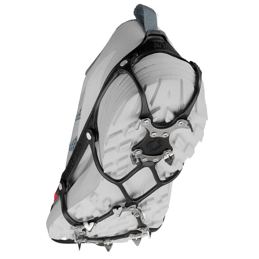 Kahtoola Microspikes Ghost Footwear Traction in an elevated walking positon, showing the underfoot TPU matrix and 12, 9mm stanless steel spikes which give solid traction on snow and ice.