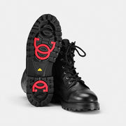 Ilves Särna Black boots showing the rubber outsole and built-in red OCSystem grips.