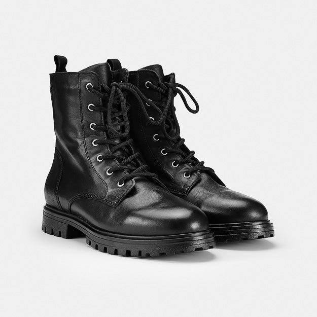 Pair of Ilves Särna Black women's leather lace-up winter boots with OCSystem ice grips.