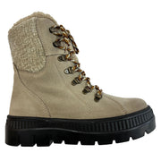 A beige suede lace-up ankle boot with a textured knit collar, brown and gold patterned laces, and a thick black lug sole, shown from a side profile on a white background. Olang Praga TEX OC Clay – Women's Winter Ice Grip Boots.