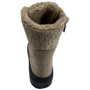 A single mid-calf boot shown from a rear three-quarter view, featuring a clay coloured suede upper, a thick textured beige sherpa fleece collar, and a black sole, isolated on a white background. Olang Praga TEX OC Clay – Women's Winter Ice Grip Boots.