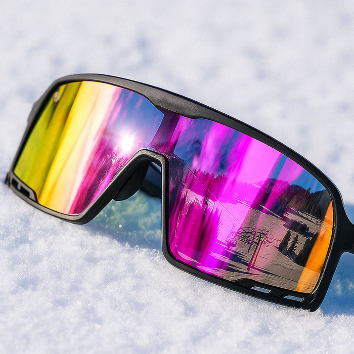 Sunglasses with colorful reflective lenses on a snowy surface. The Black on Black Campeone is built around Knockaround’s innovative Knockterra performance lens technology, Campeone sunglasses deliver crystal-clear vision, UV400 protection, and impact-resistant durability. Their sleek wraparound design guards against low winter sun and glare reflected from snow and ice, while rubberized adjustable nose grips and flexible non-slip arms ensure a secure, all-day fit during high-energy winter pursuits.