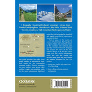 Back cover of the Trekking the Engadine guide book with mountain scenery and text about hiking routes in Switzerland.