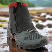 Kahtoola RENAgaiter shown on a trail shoe sat in a puddle. Demonstrating the type of conditions in which the RENAgaiter would be used. Buy now at ICEGRIPPER.