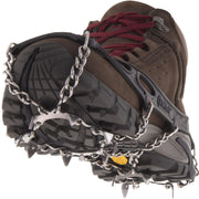 Black Kahtoola Microspikes on a boot, showing sole spike array, from ICEGRIPPER