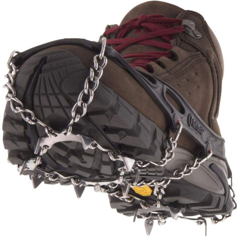 Black Kahtoola Microspikes on a boot, showing sole spike array, from ICEGRIPPER